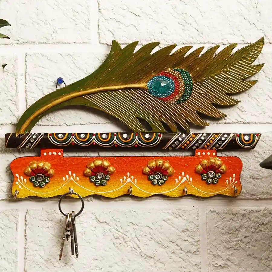Whimsical Mor Pankhi Wooden Key Hanger with four hooks, vibrant multi-colored design, and durable wood material.
