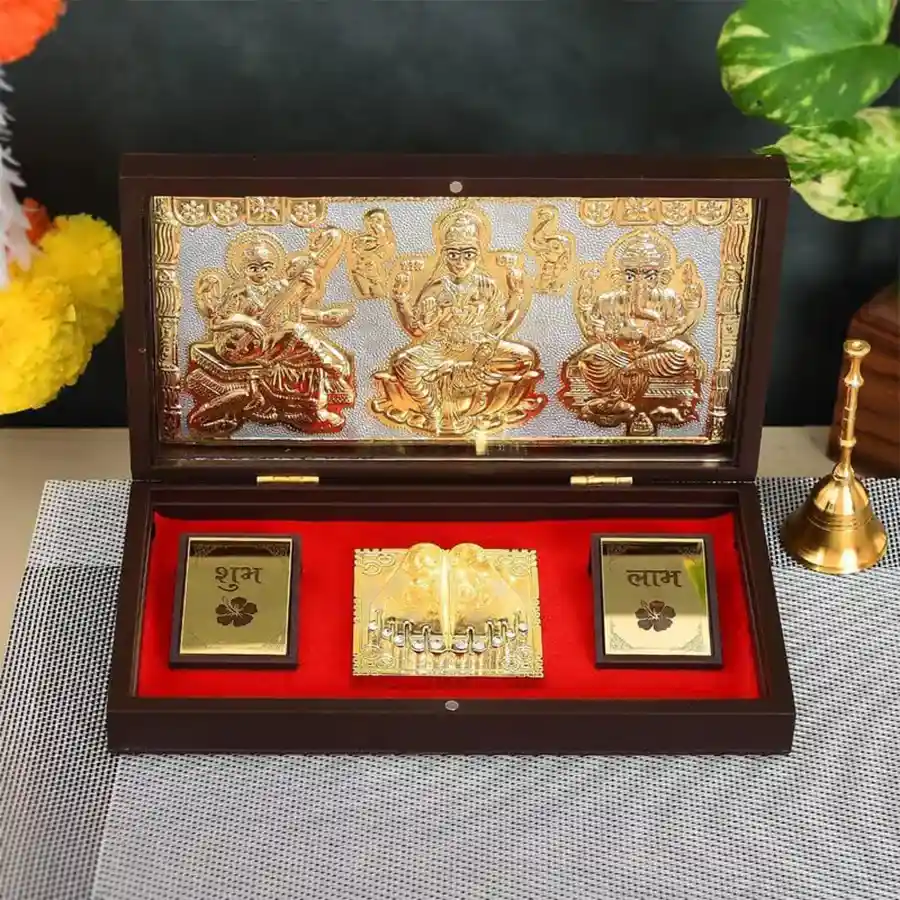 Gold-plated Lakshmi Ganesh Saraswati Photo Frame and Shubh Labh Charan Paduka Set, elegantly designed for home decor and gifts.