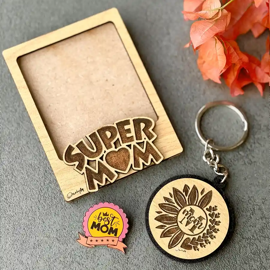 Heartfelt gift set for mothers including a polaroid magnet frame, engraved keychain, and lapel pin celebrating super moms.