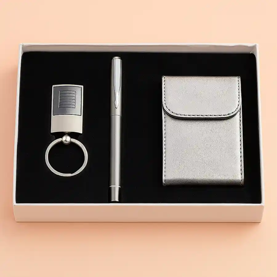 A stylish steel finish key ring with a pen and visiting card holder, perfect for gifting.