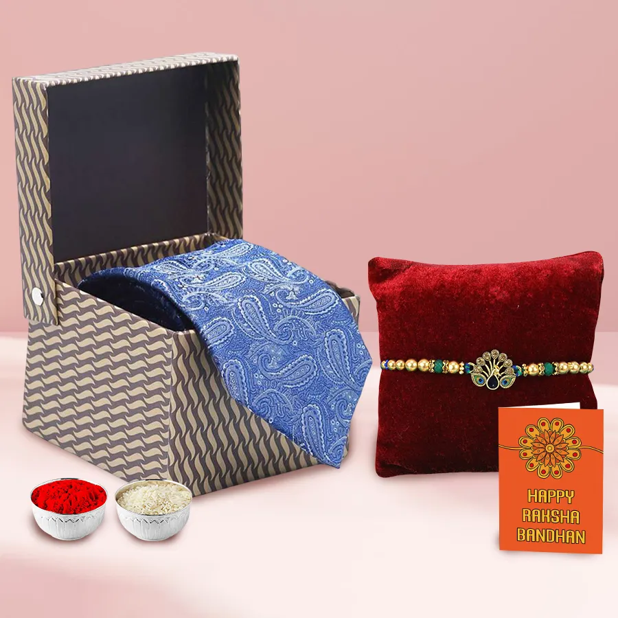 Pure Silk Tie from Raymonds accompanied by a Rakhi, Rali Tilak, and pack of Chawal.