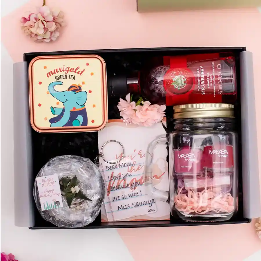 Everlasting Hamper of Love for Mom, featuring tea, succulent, shower gel, nail paints, scrunchie, soap, keychain, in a reusable black box.