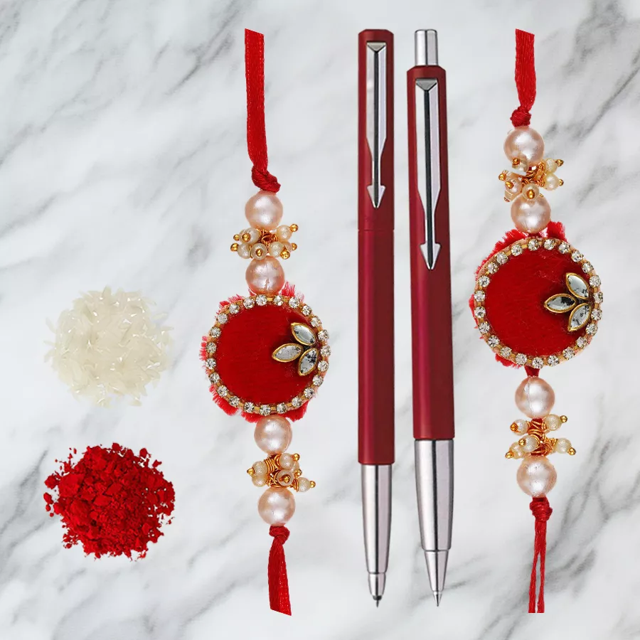 Trendsetting Parker Pen Set with two decorative Rakhis, Roli, Tilak, and Chawal, beautifully wrapped for Raksha Bandhan celebration.