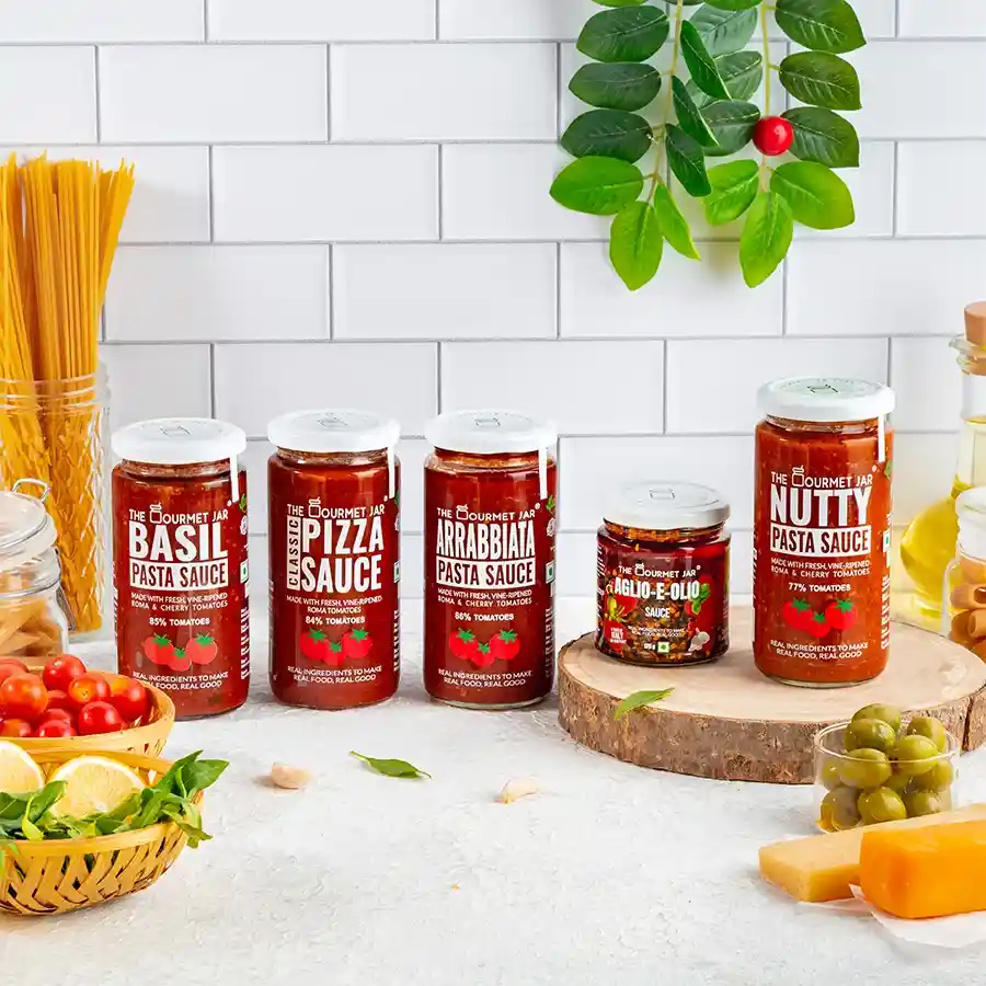 Five gourmet Italian sauces in a beautifully packaged gift set, including Basil, Nutty, Arrabbiata, Classic Pizza Sauce, and Aglio-E-Olio.