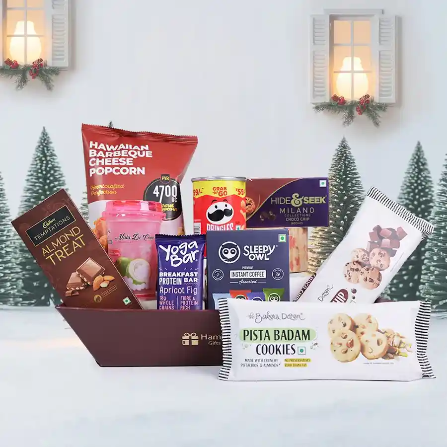 A beautifully arranged Festive Snack Extravaganza Basket filled with assorted snacks including gourmet popcorn, chocolate bars, cookies, and coffee.