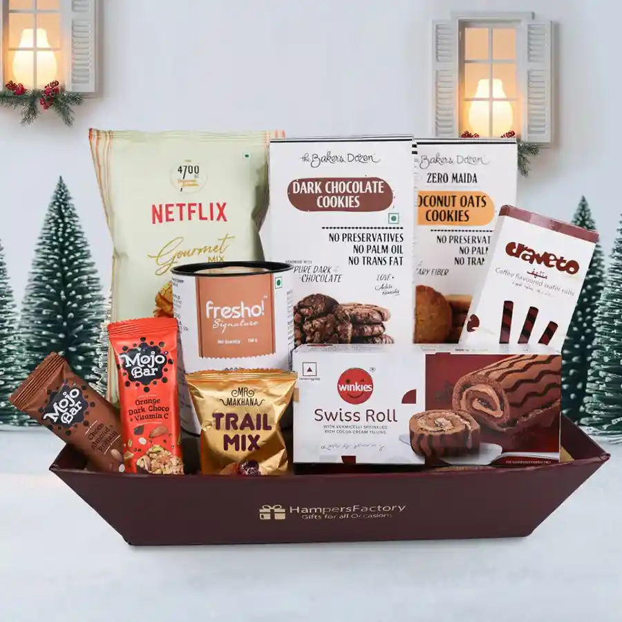 Tasty Festive Treats Basket with gourmet snacks including cookies, popcorn, and chocolates, beautifully arranged in a reusable basket.