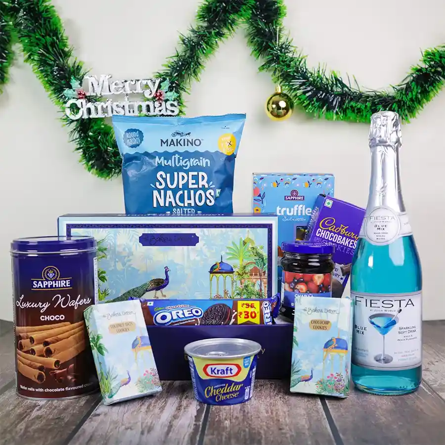 Festive Gourmet Indulgence Basket featuring an assortment of delightful treats including cookies, chocolates, cheese, and sparkling juice for the holiday season.