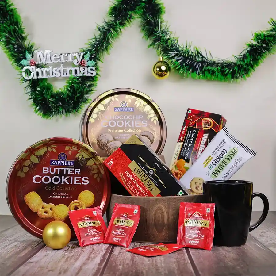 Luxurious Holiday Bliss Cookies and Tea Set in a reusable basket, featuring assorted cookies and Twinings English Breakfast Tea.