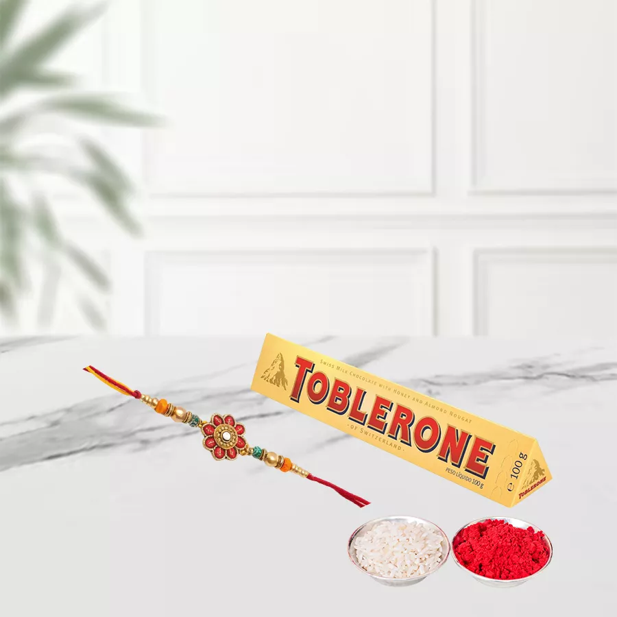 100g Toblerone chocolate bar with a Rakhi set including Roli, Tika, and Chawal