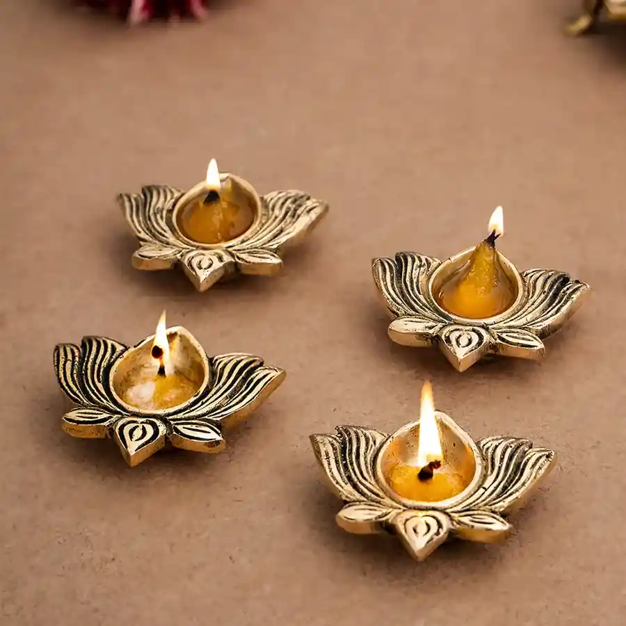 Gleaming Brass Diya Gift Set featuring four gold-finished diyas, elegantly crafted from brass, ideal for decoration and blessings.