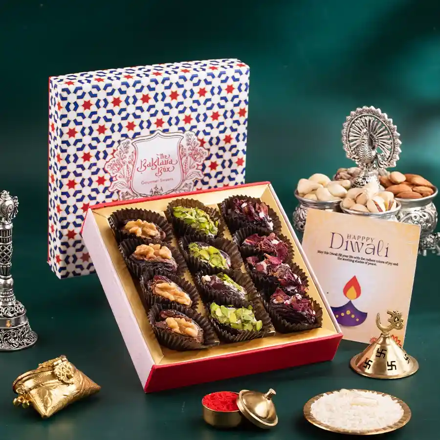 A beautifully packaged box of decadent chocolate-covered dates, featuring an assortment of rich flavors and textures, perfect for gifting.