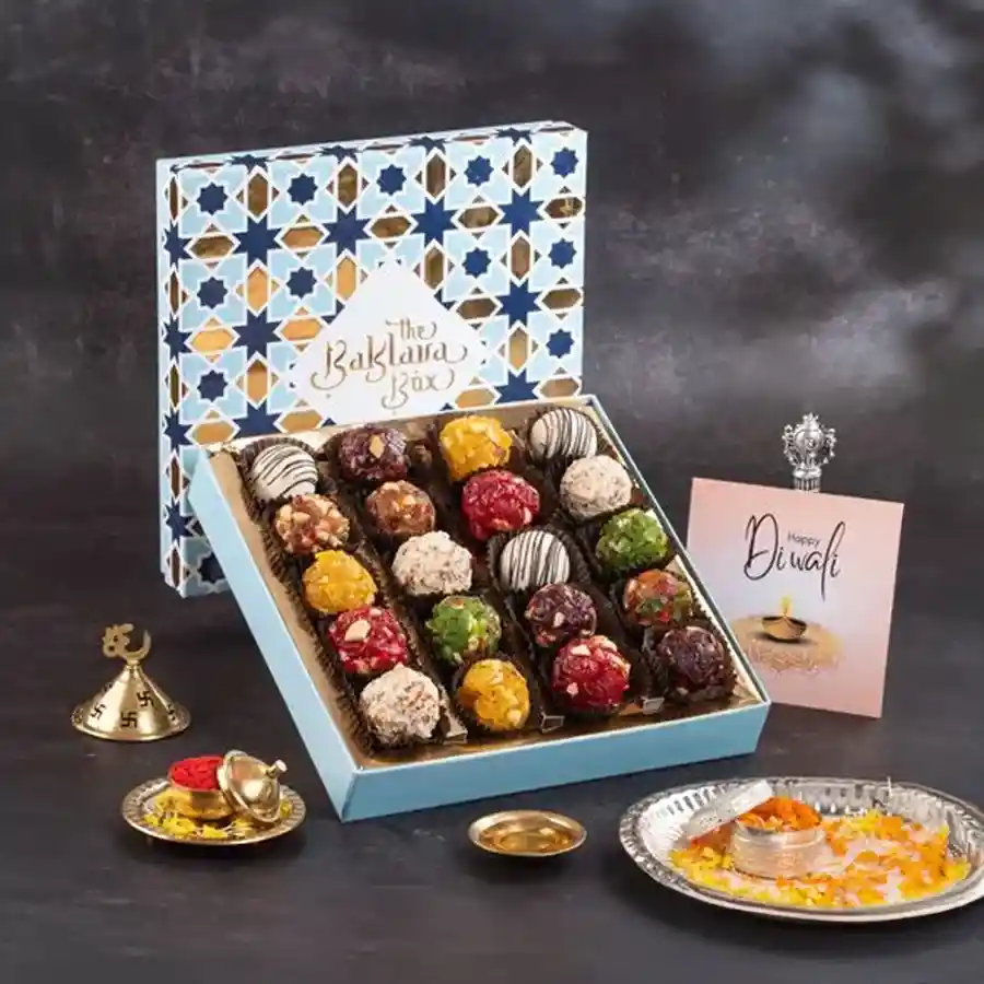 Indian Fusion Sweet Celebration Box with assorted sweets in a blue gift box.
