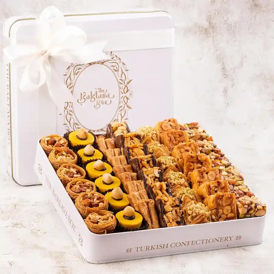 Charming White Tin Baklava Collection featuring assorted baklava in a stylish tin.