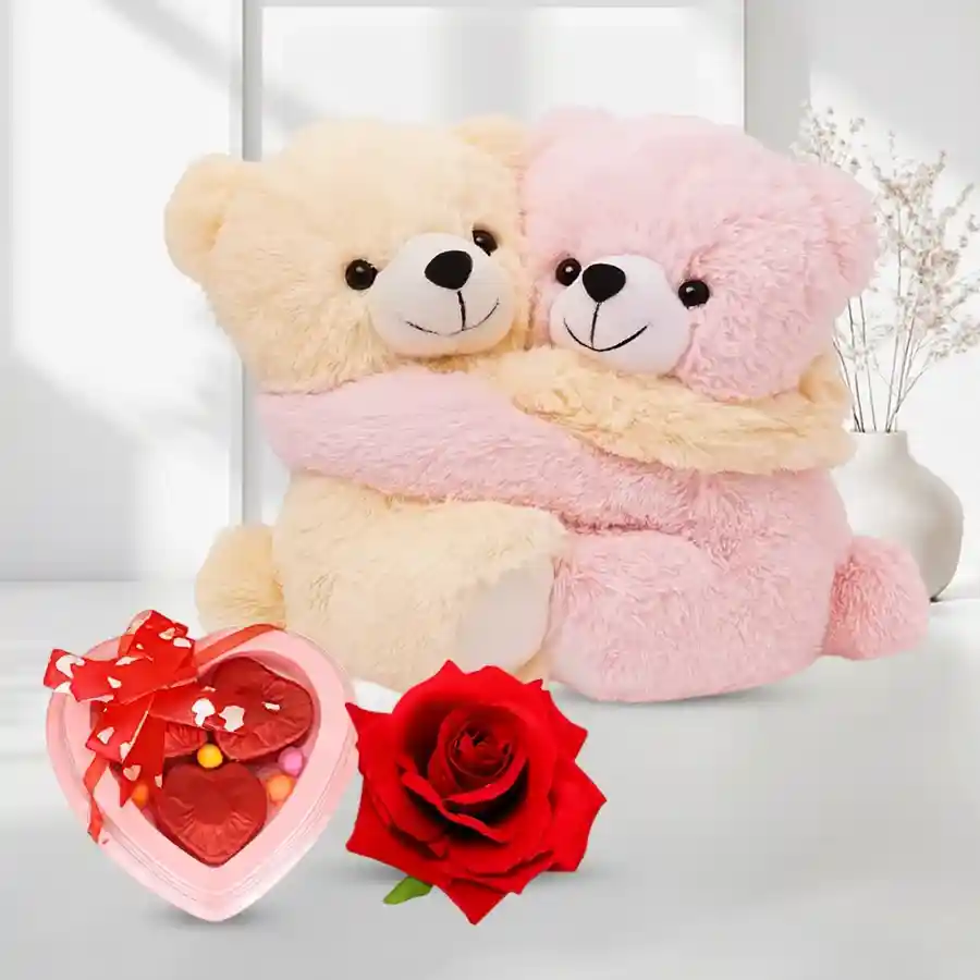 Cuddly couple teddy with a velvet rose and homemade chocolates.