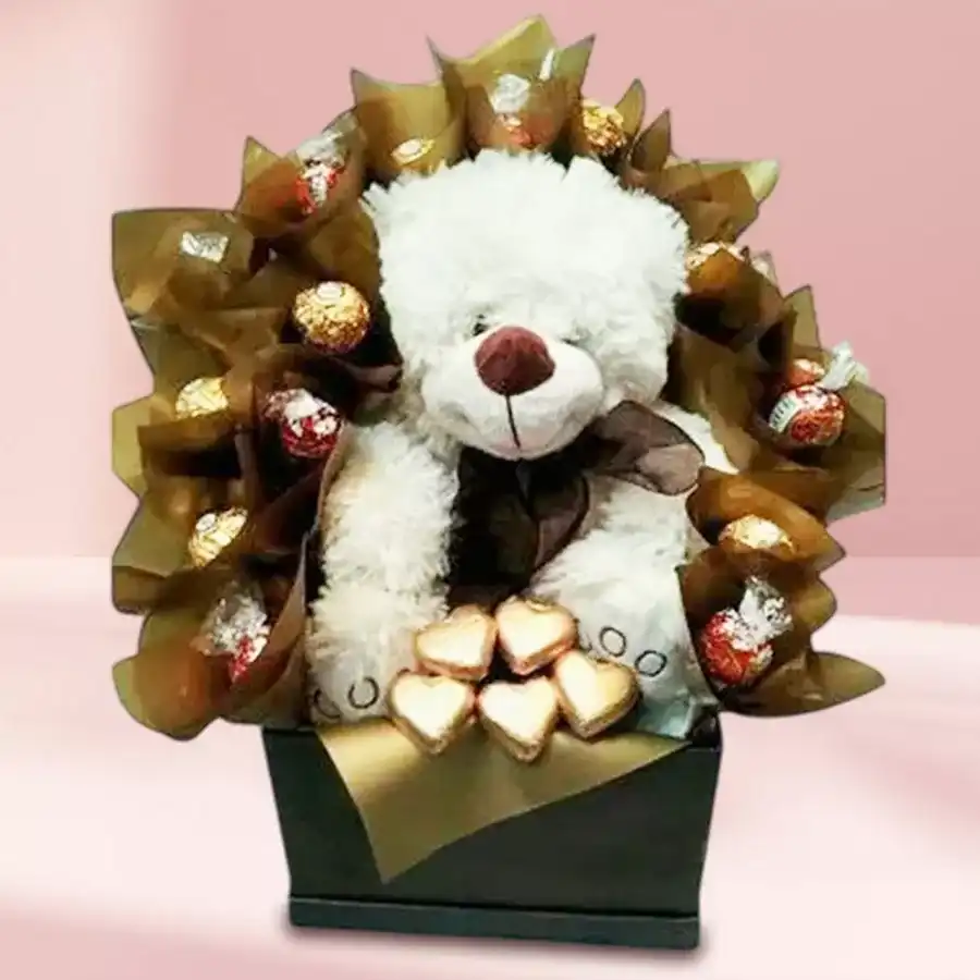 8-inch teddy bear with an assortment of handmade chocolates, including heart-shaped treats.