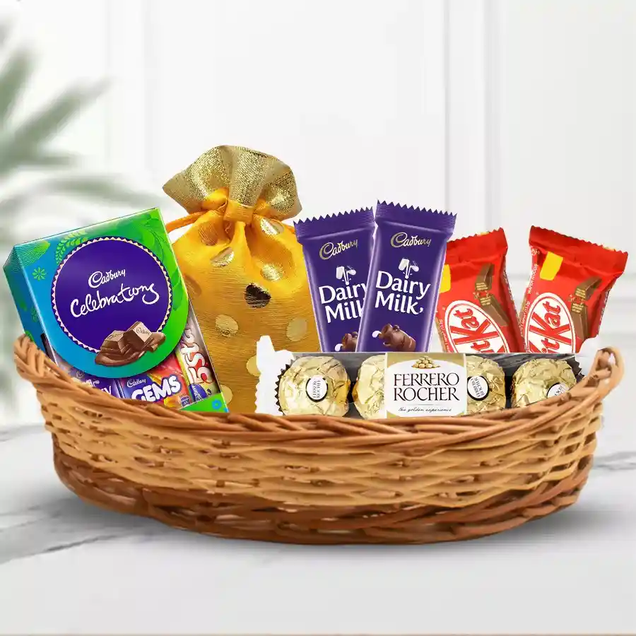 Heartfelt Chocolate and Nut Delight gift hamper with assorted chocolates and dry fruits in a decorative tray.