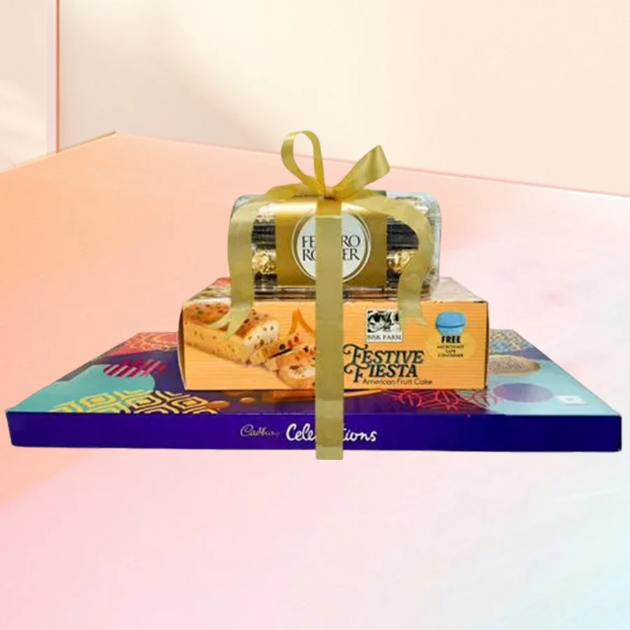 A towering cake gift featuring three layers of chocolate and dry fruit delights, including Ferrero Rocher and Cadbury chocolates.
