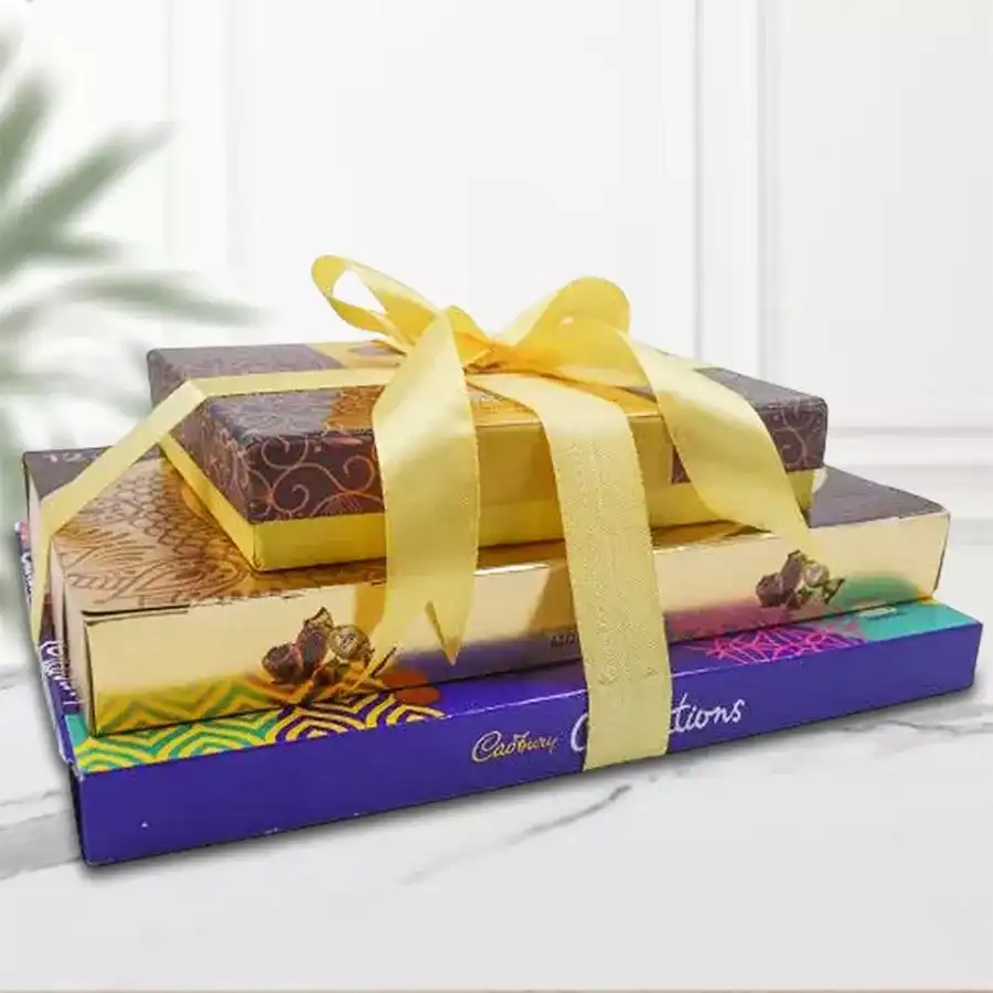 Nutty Chocolate Indulgence Tower with assorted chocolates and dried nuts.