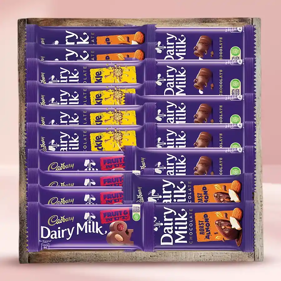 Classic Cadbury Chocolates Assortment in a wooden tray with ribbon.