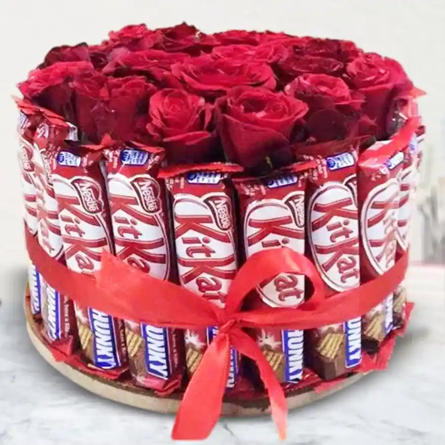Arrangement of 25 Kitkat chocolates with 15 red roses.