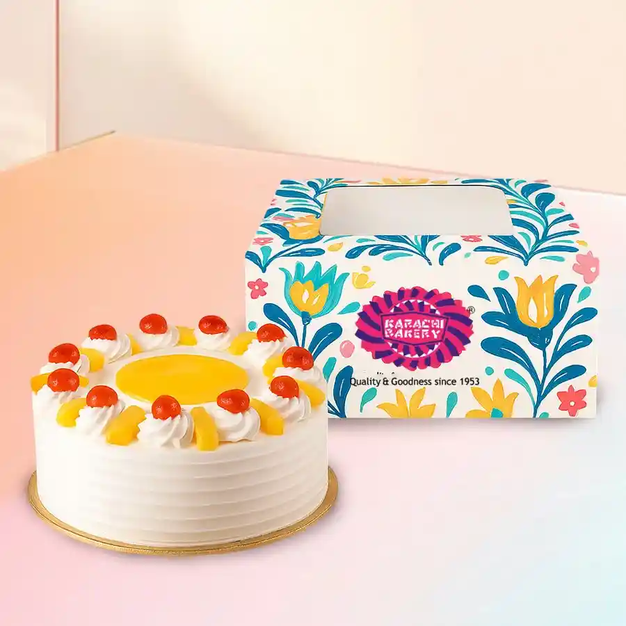 A delectable 1-pound Tropical Pineapple Cake from Karachi Bakery featuring moist sponge, pineapple filling, and creamy frosting.