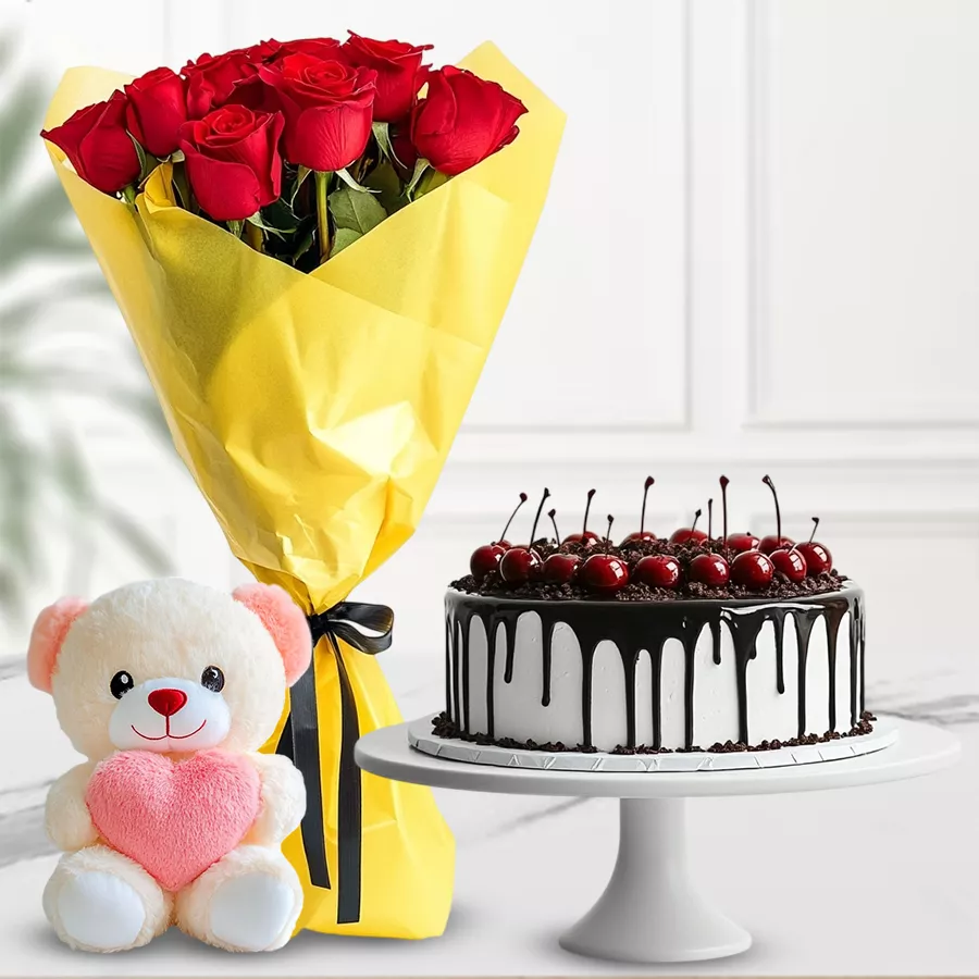 A beautiful hamper featuring red roses, a Black Forest cake, and a small teddy bear, perfect for gifting to loved ones.