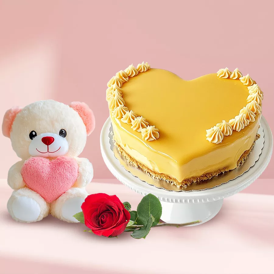 Heart-shaped butterscotch cake with a single rose, perfect gift combo.