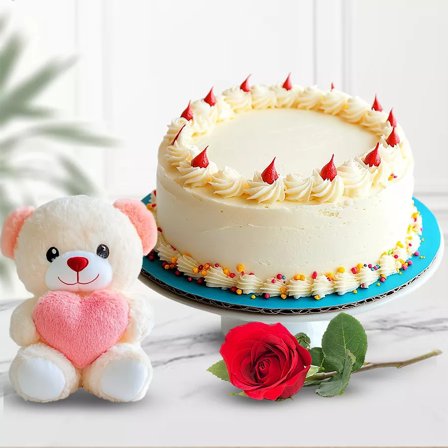 Sweet Surprise gift set featuring an eggless vanilla cake, a rose, and a teddy bear.