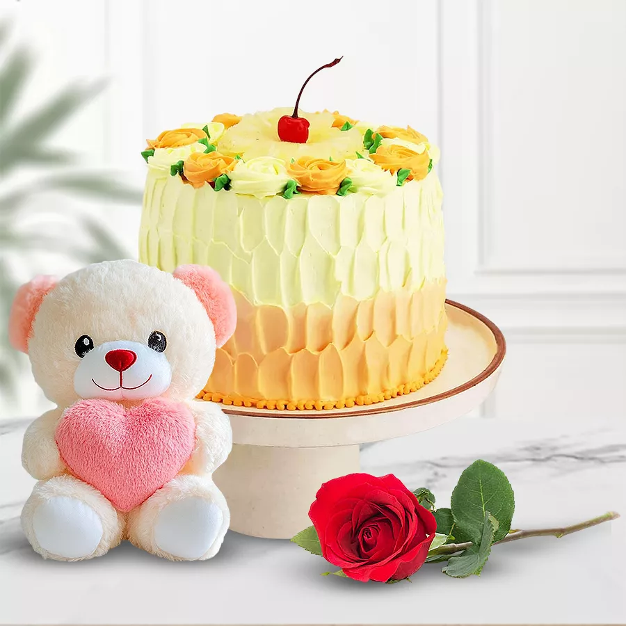 Eggless Butterscotch Cake with a teddy bear and red rose.