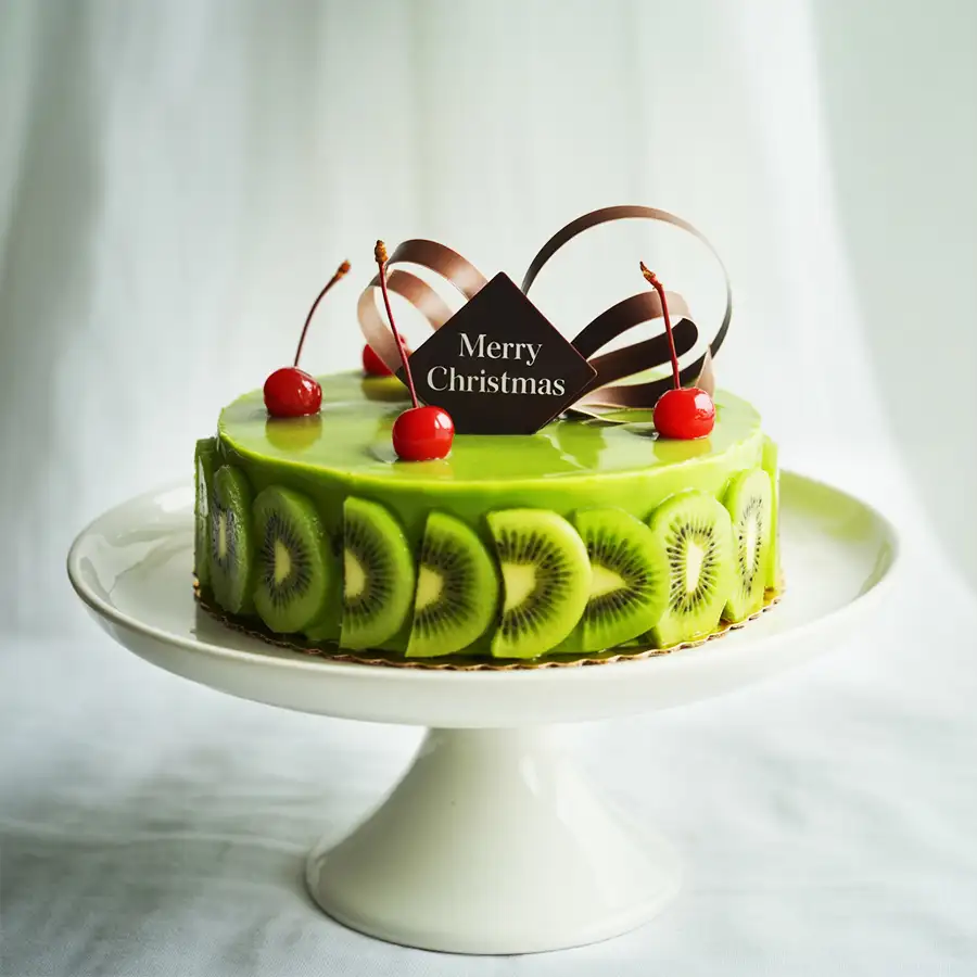 A beautifully wrapped 1 lb Kiwi Cake, perfect for Christmas gifting.