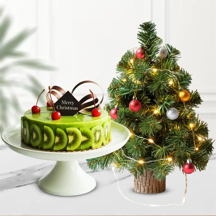 A delightful Kiwi Cake with a festive Christmas Decor Tree, perfect for holiday celebrations.