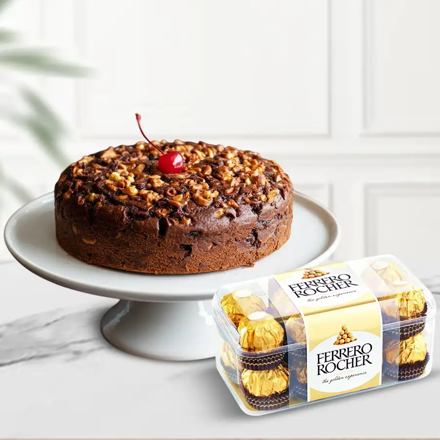 A festive gift featuring a 1 lb Dry Plum Cake with 16 Ferrero Rocher chocolates, perfect for Christmas celebrations.