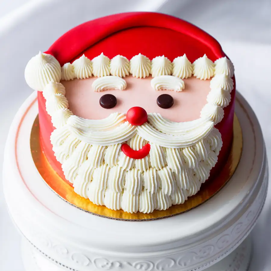 Santa's Fondant Fantasy Cake, a 2.2 lb Christmas-themed dessert designed to spread joy and festive cheer.