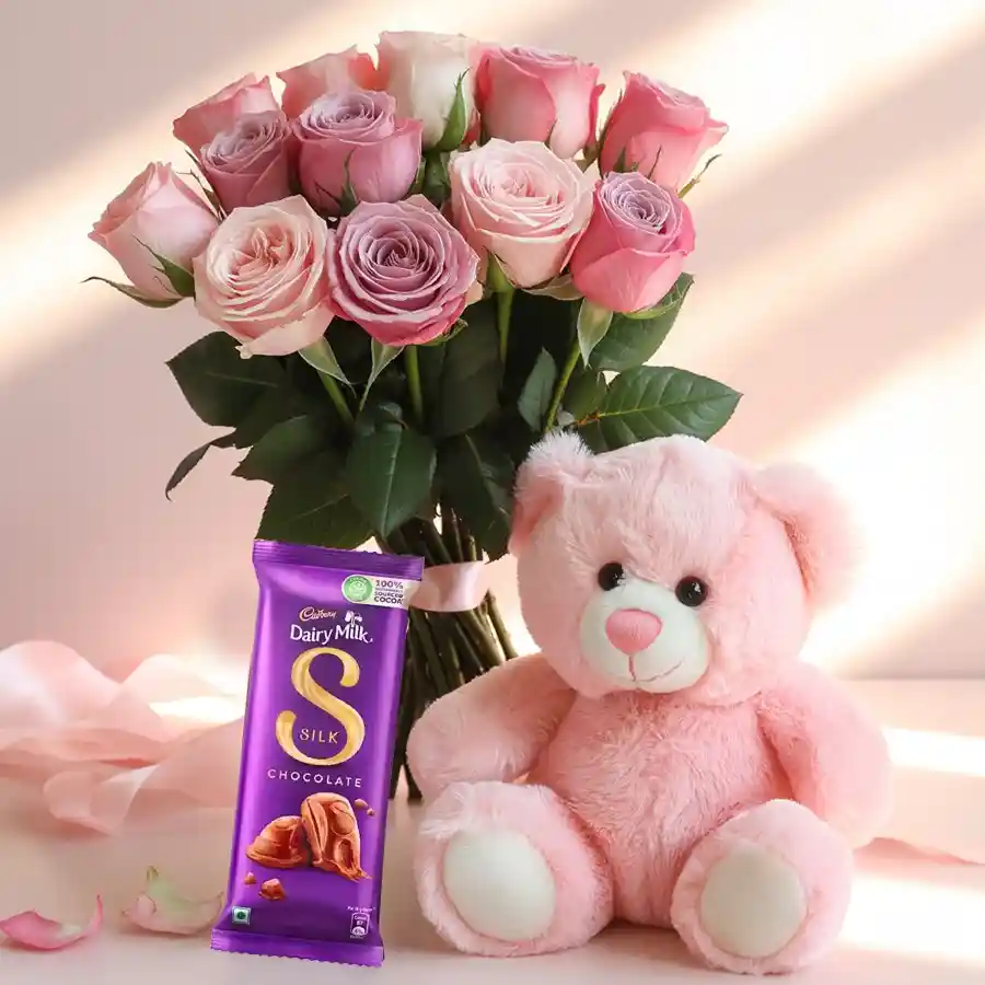 Elegant pink roses bouquet with teddy bear and chocolate bar.