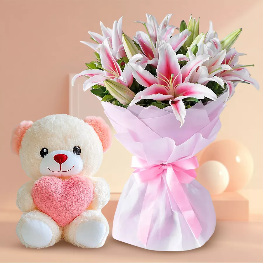 Adorable 6-inch teddy bear with 6 pink lilies wrapped in pink tissue.
