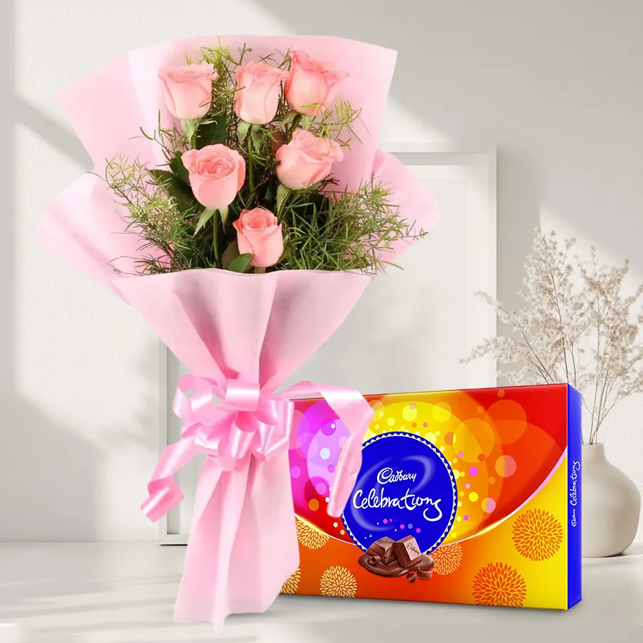 A bouquet of 10 pink roses accompanied by a Cadbury Celebrations pack, perfect for birthdays and special occasions.