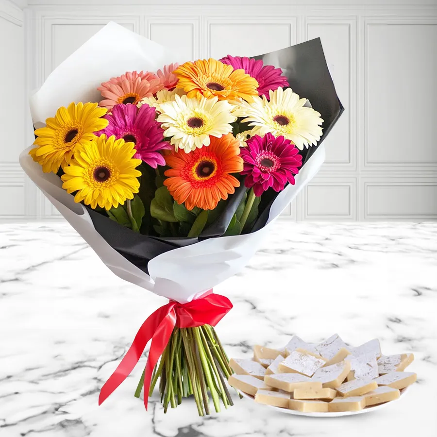 Kaju Katli and vibrant mixed gerbera bouquet combo for celebrations.