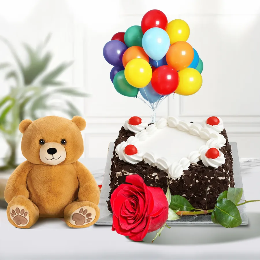 Heartwarming gift combo featuring a rose, Black Forest cake, teddy bear, and colorful balloons for special occasions.