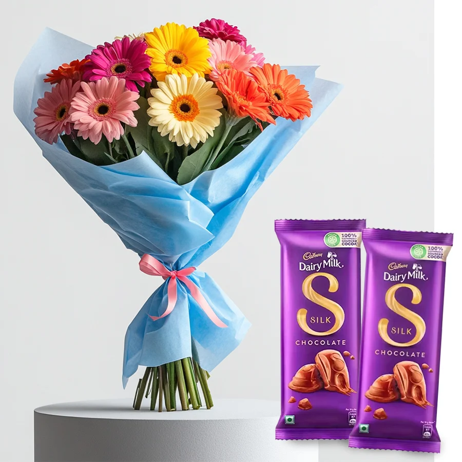A vibrant arrangement of assorted gerberas accompanied by two Dairy Milk Silk chocolate bars, perfect for gifting.