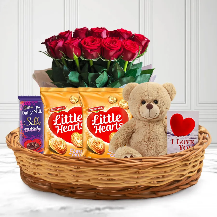 Gift Hamper of Love featuring teddy bear, chocolates, balloons, and red roses.