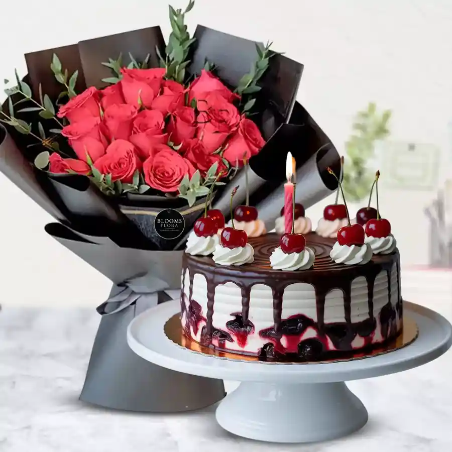 Beautiful roses bouquet paired with Black Forest cake and candles for a special celebration.