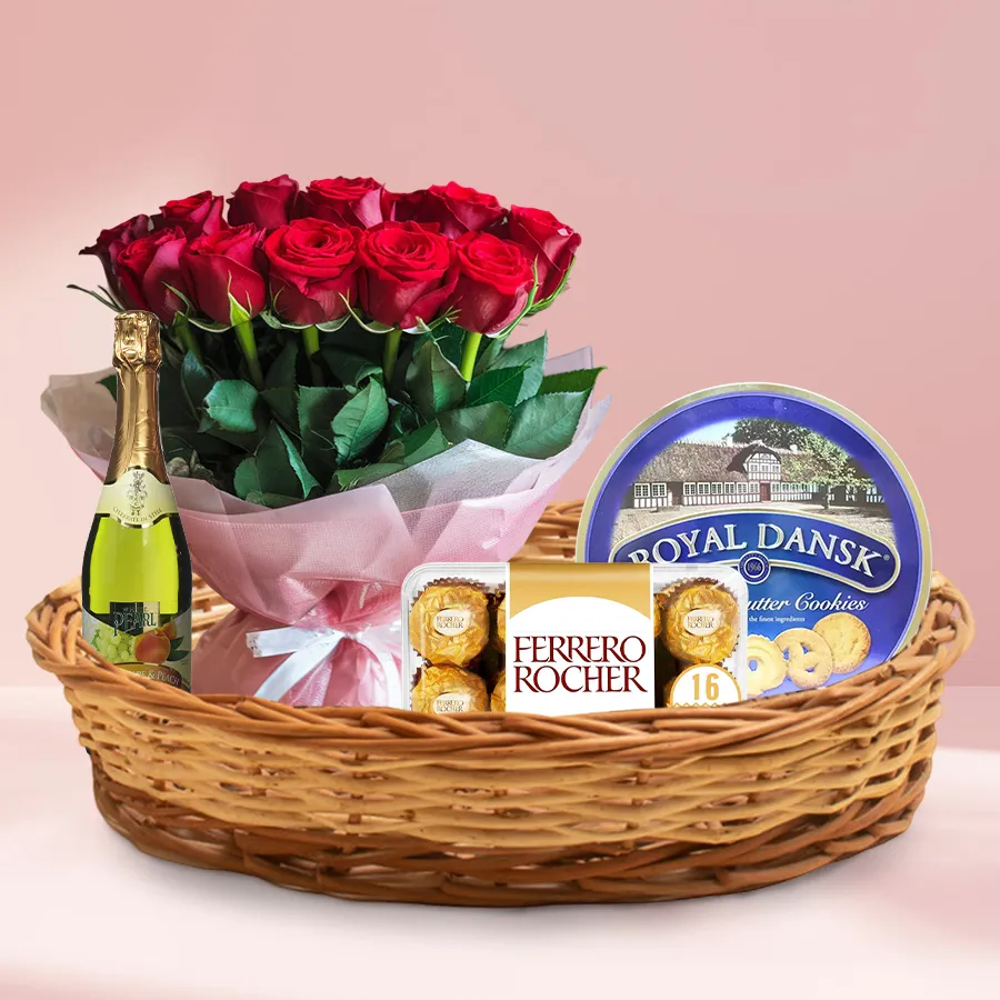 Traditional Love in a Basket with roses, chocolates, cookies, and juice.