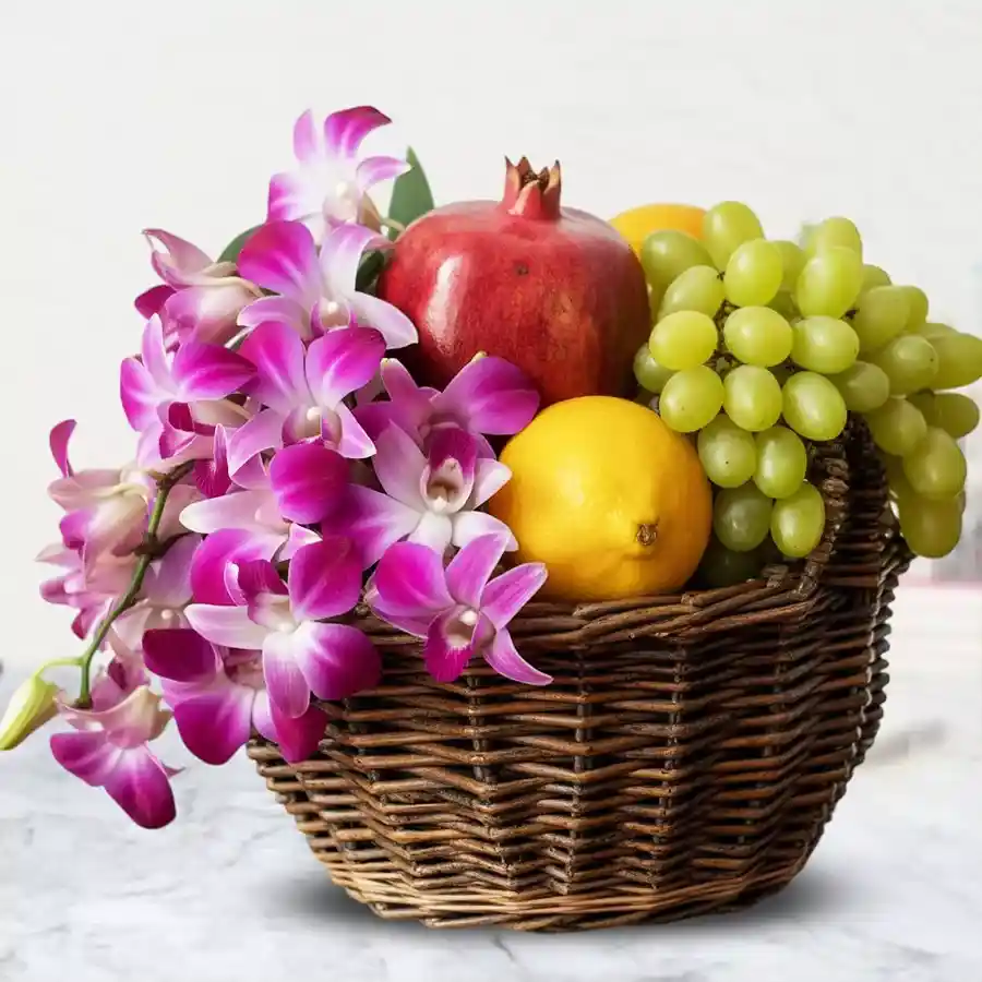 Floral & Fruity Delight Basket with fresh fruits and orchids.