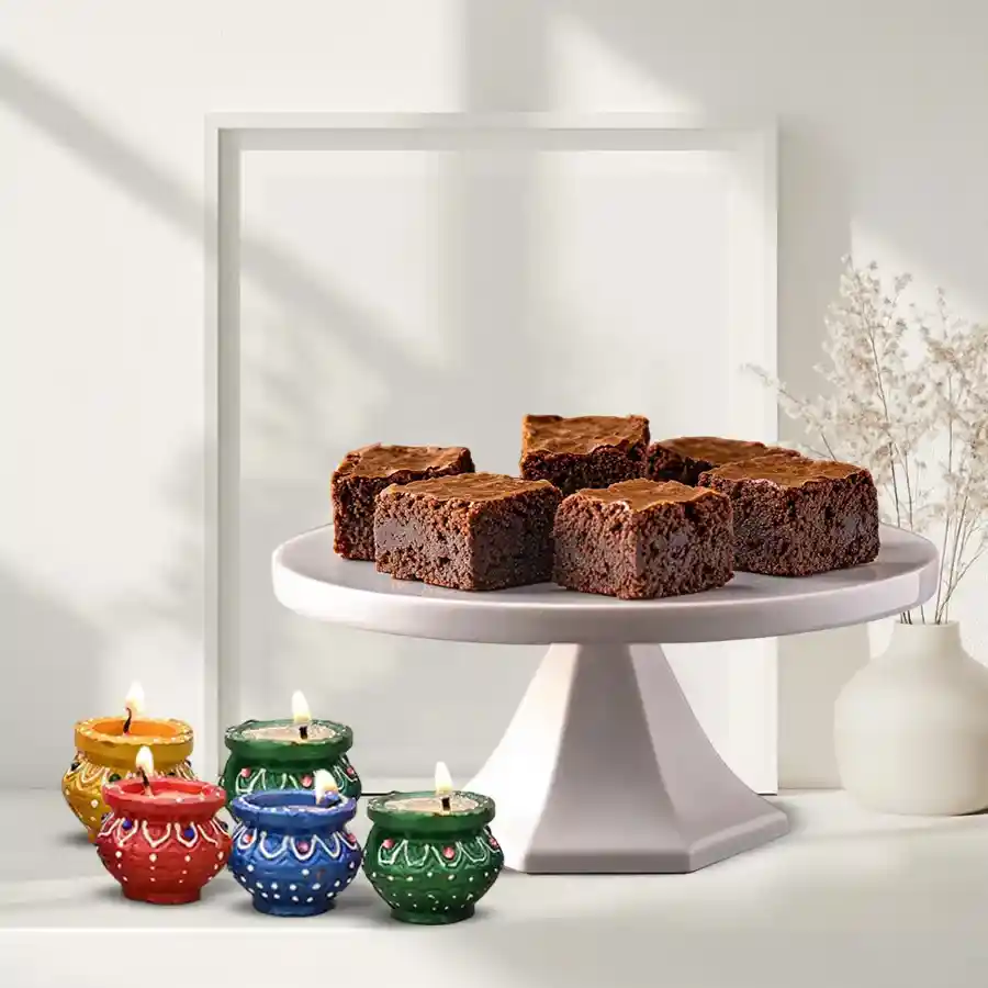 Diwali gift combo featuring tasty brownies and decorated diyas for a festive celebration.