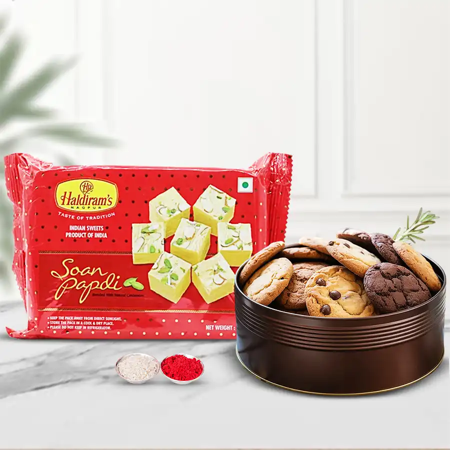 Haldirams Soan Papdi and assorted cookies gift set for Bhai Dooj, including Roli Tika and Chawal.