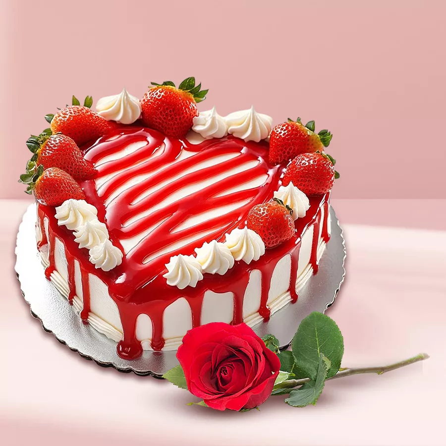 Heart-shaped strawberry cake with a single red rose for gift-giving.