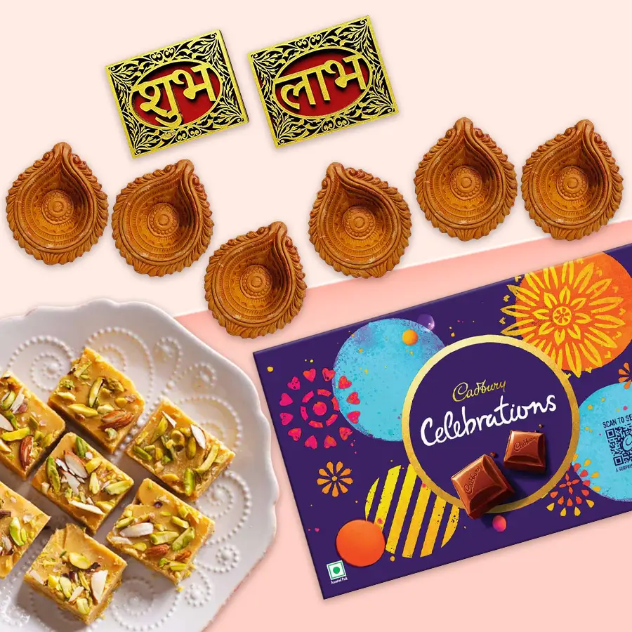 Diwali Joyful Treats Gift Set featuring Soan Papdi, Cadbury Celebrations, wall sticker, and Mud Diyas for festive gifting.