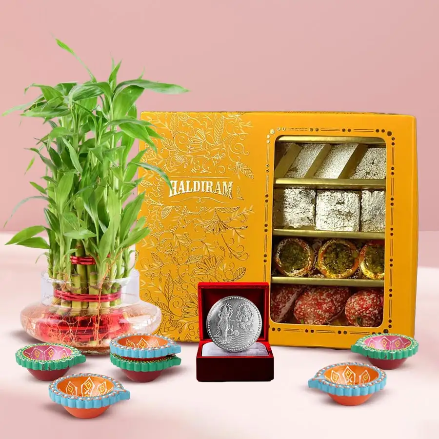Festive Bamboo Bliss Gift Set with 2 Tier Bamboo Plant, sweets, diyas, and a silver coin for Deepavali celebrations.