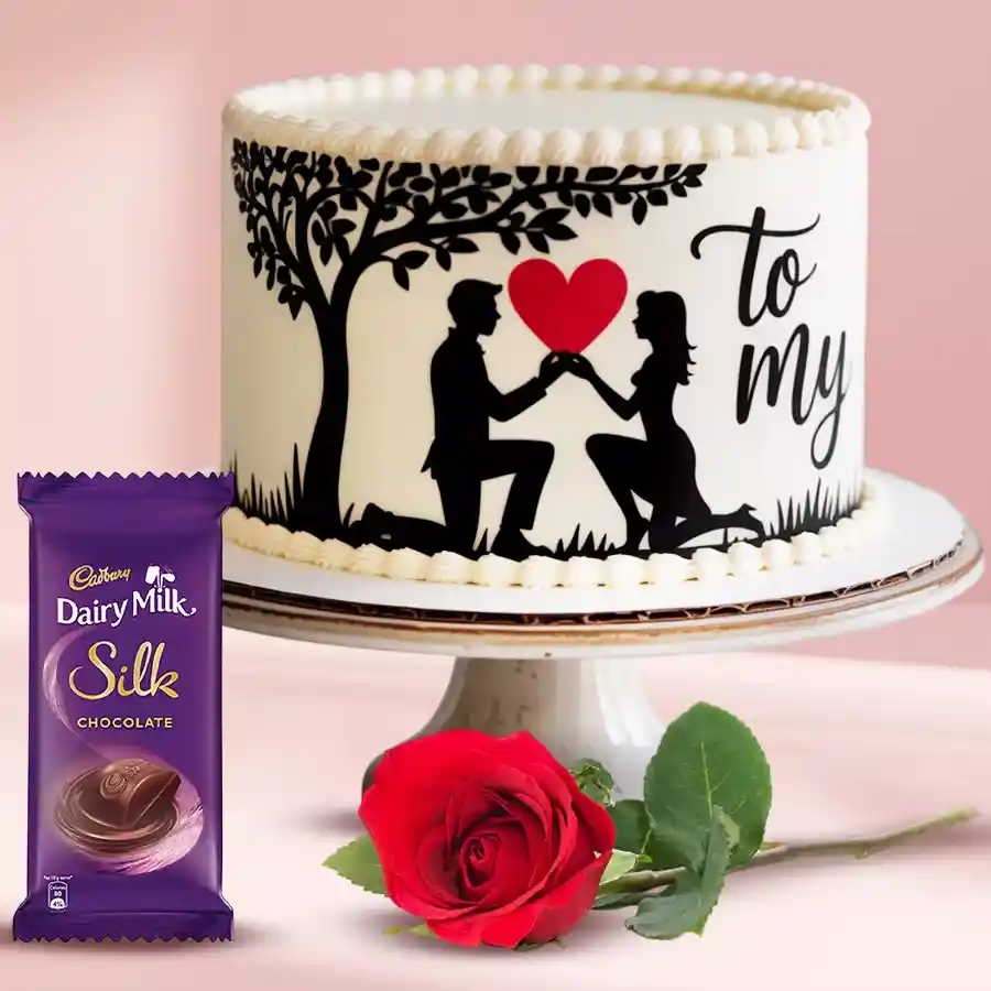 Personalized vanilla photo cake with red rose and Cadbury Silk chocolate for a romantic gift.