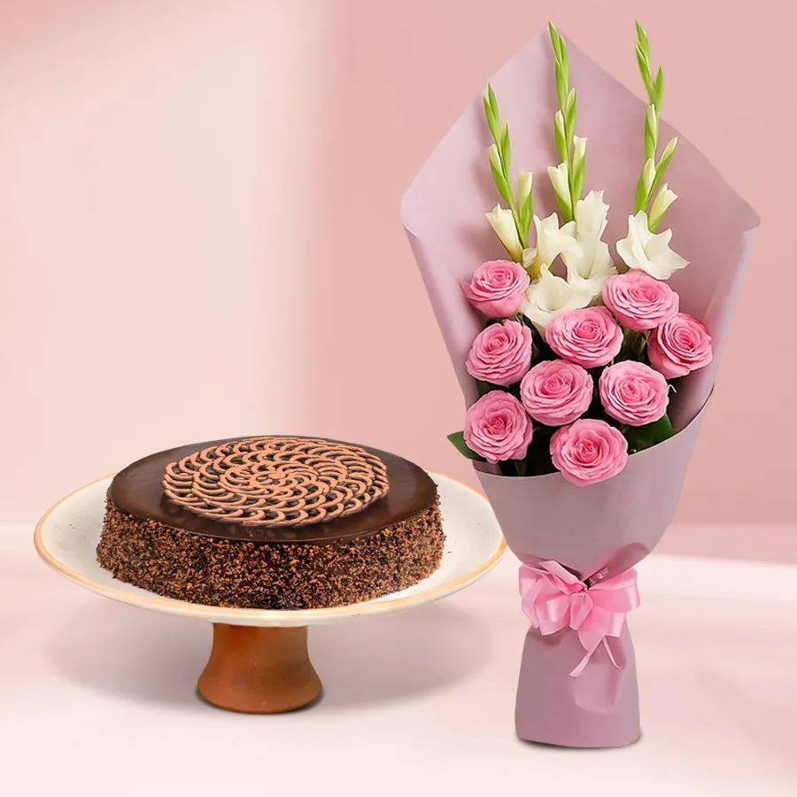 Enchanting bouquet of pink roses and white gladiolus with a luscious strawberry cake.